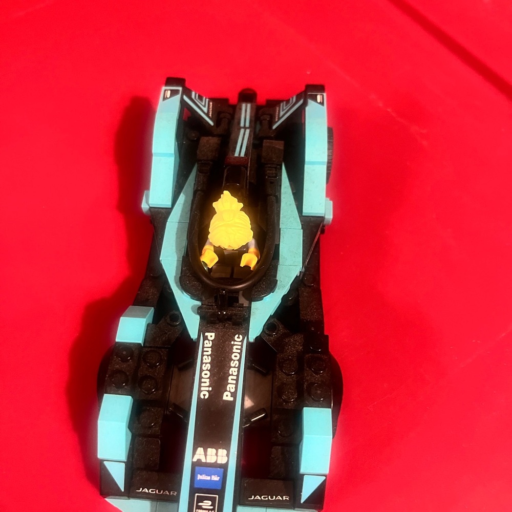 Panasonic Blue and Black Racing Toy Carl